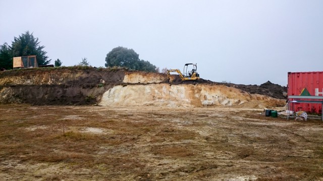 Adding some top soil on the middle terrace