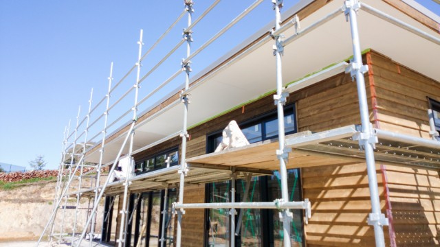 Meanwhile outside: Painter working on the soffit