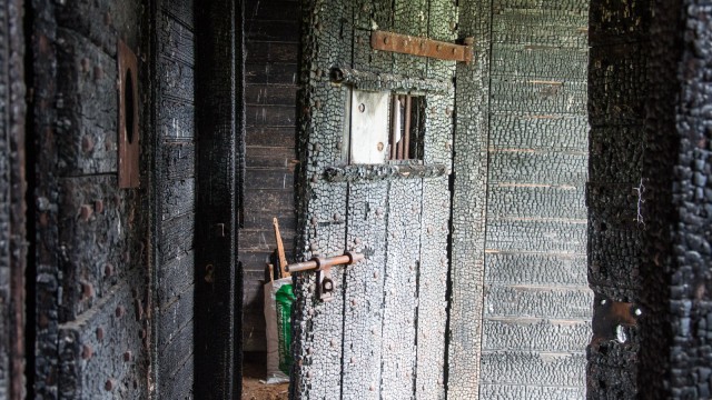 A burnt-down prison cell
