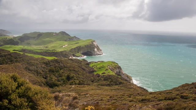 Viewing west from the lighthouse, to the green hills of Wharariki