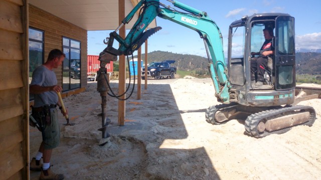 Drilling holes for the concrete foundations