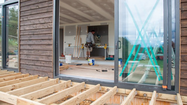 Busy builders laying the floor very precisely