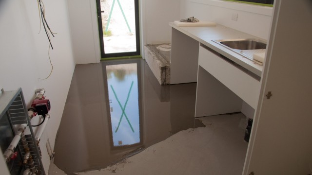 Levelling the floor to make the tiles flush with the timber floor