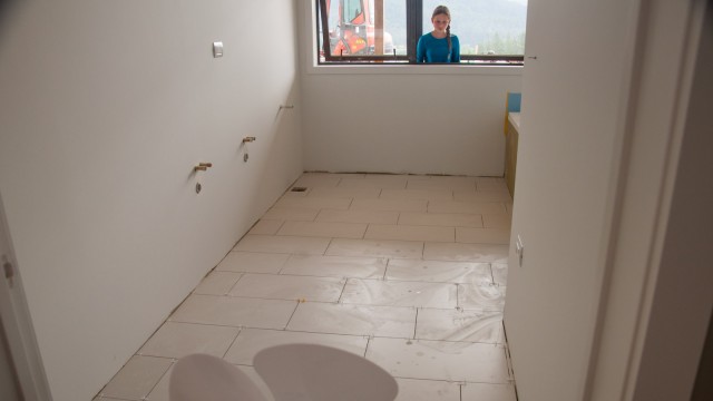 Floor tiles in the kid's bathroom almost finished