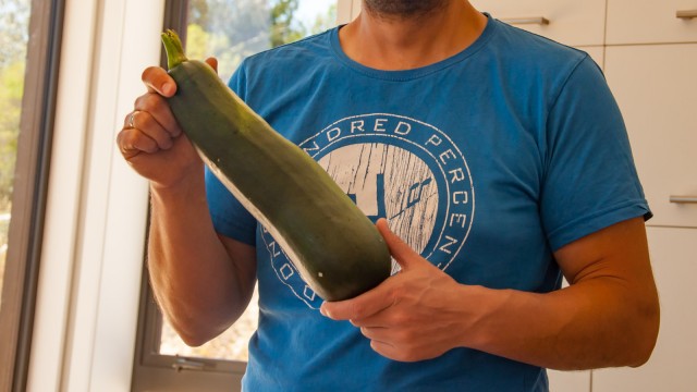 Harvesting the first massive zucchini from our garden