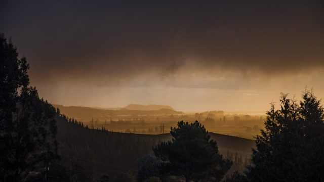 and the sun still shining behind those black fog clouds