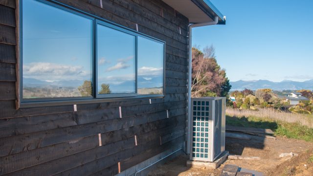 At the same time: Moving the noisy heat pump to the garage, away from the house