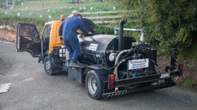 Heating up the tar in the truck